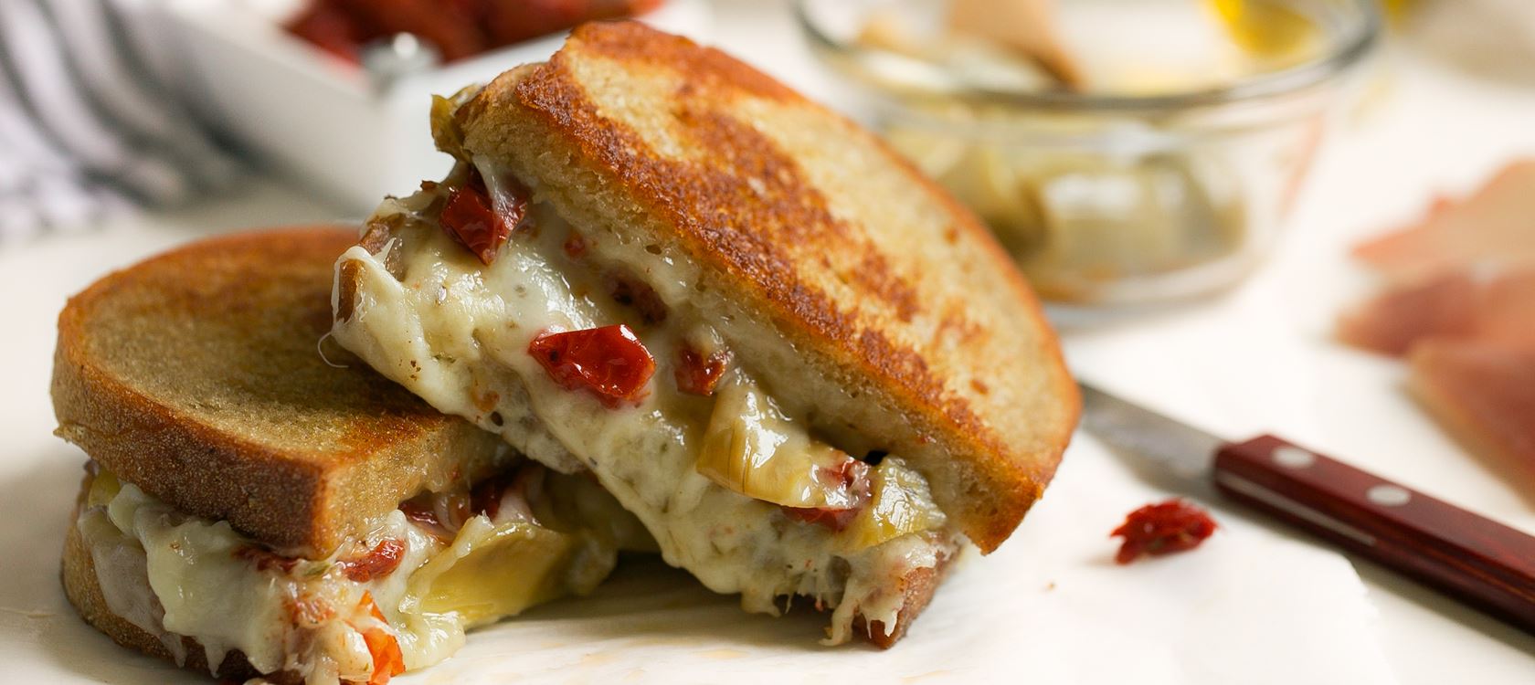 Grilled Cheese with Sun Dried Tomatoes, Artichokes, and Prosciutto