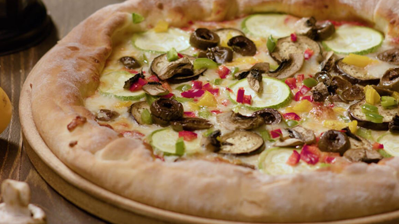 Vegetarian pizza with Puck Shredded Mozzarella & Kashkaval Cheese Mix