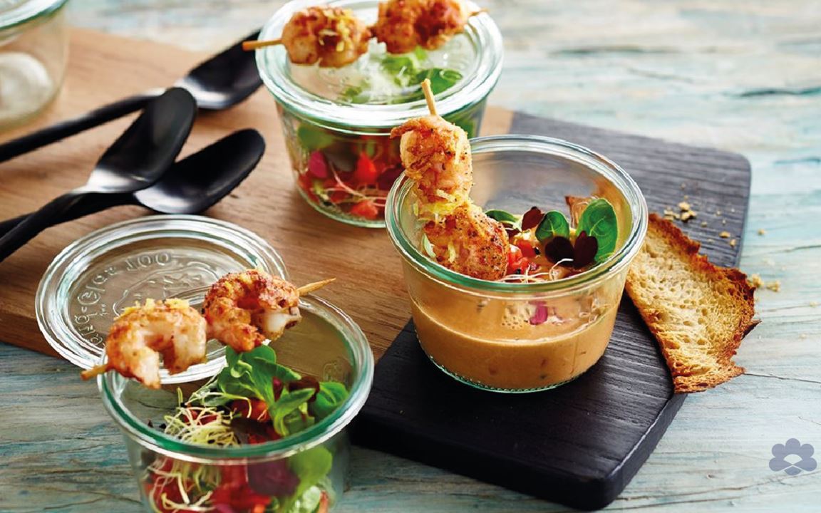 Seafood soup with scampi skewers