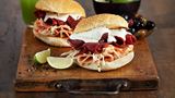 Burgers with cheese, cold cuts meat and coleslaw