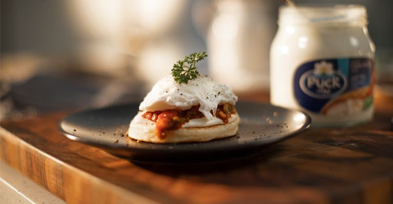 Moroccan Harcha with Poached Eggs, Spicy Tomato Sauce and Cream Cheese Spread