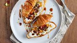 Croissants with cream cheese, dried fruits and nuts