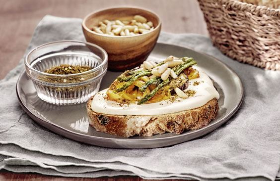 Toast with cheese, grilled vegetables, zaatar and pine nuts