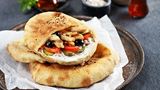 Arabic bread with cream cheese, chicken strips and vegetables