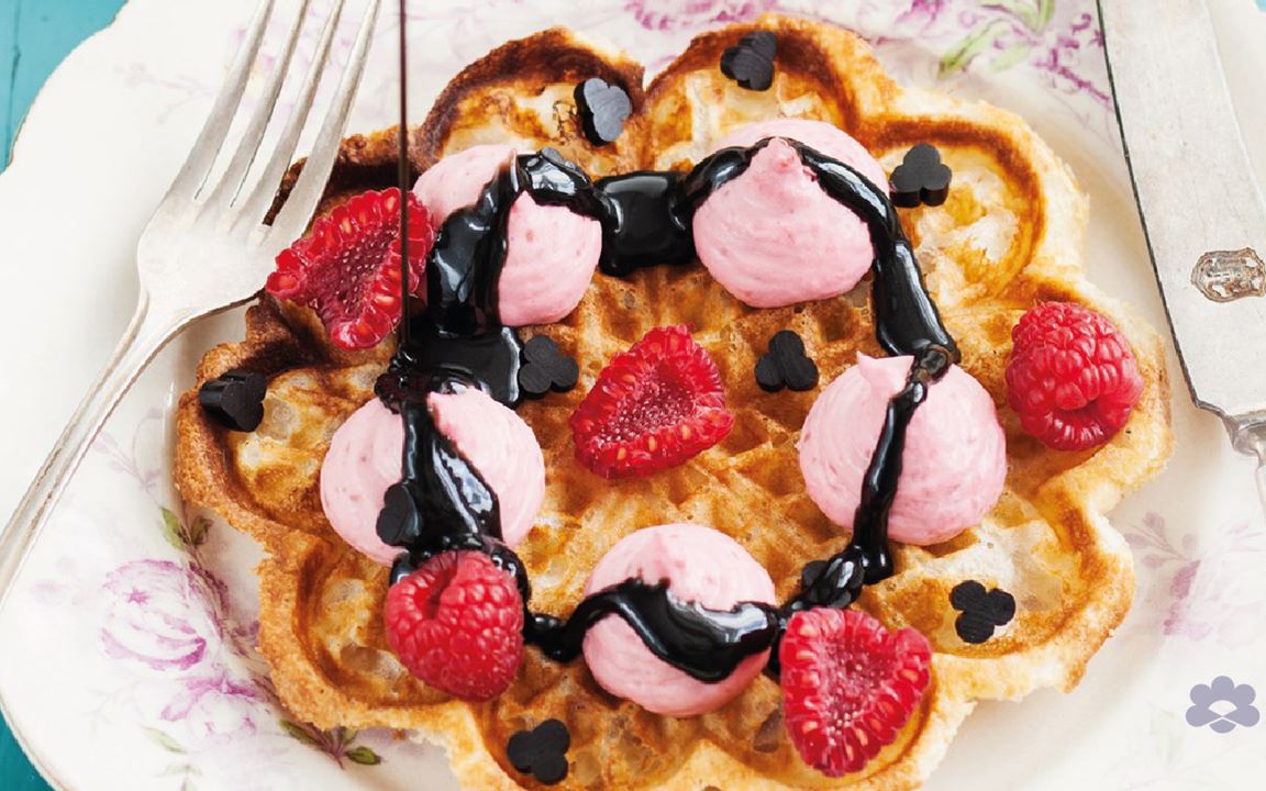 Waffles with whipped raspberry panna cotta and liquorice sauce 