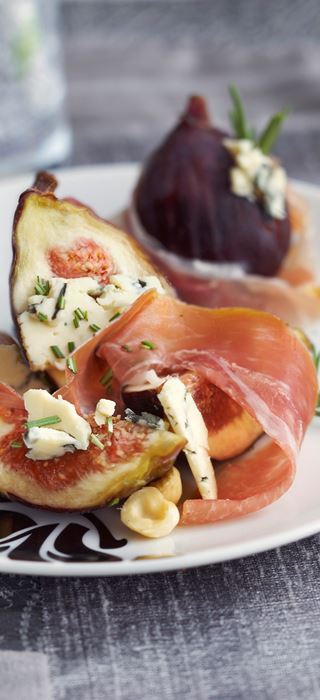Grilled prosciutto wrapped figs stuffed with Blue Cheese