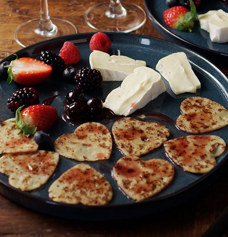 Heart-shaped pancakes with Double Cream Brie and berries