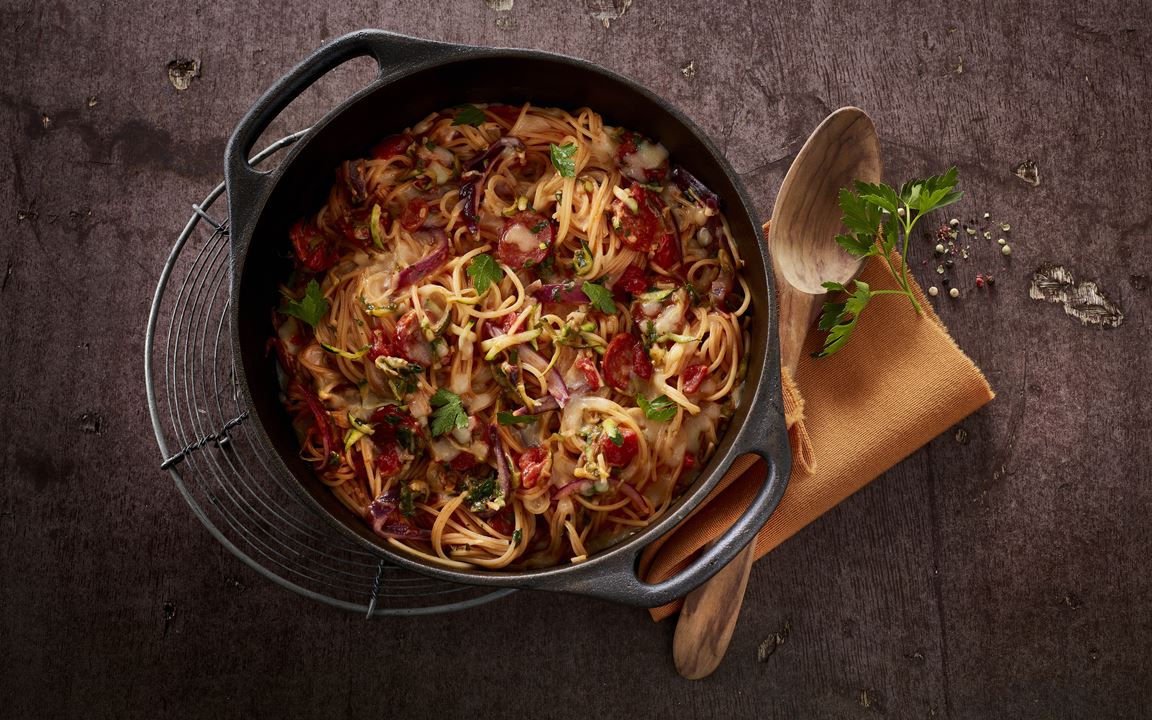 One-pot pasta dish with courgette and spicy sausage