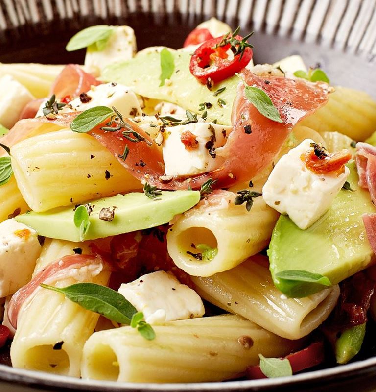 Pasta with sundried tomatoes, avocado, prosciutto and Castello® Greek Style Cheese Cubes
