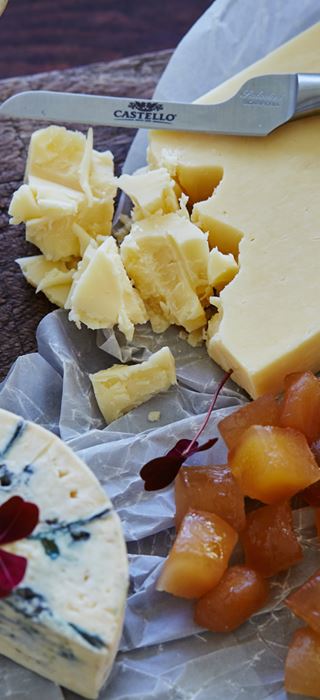 Cheese board with lemon curd and candied ginger