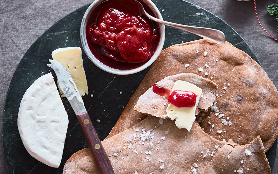 Giant crisp breads with plums and Double Crème White 