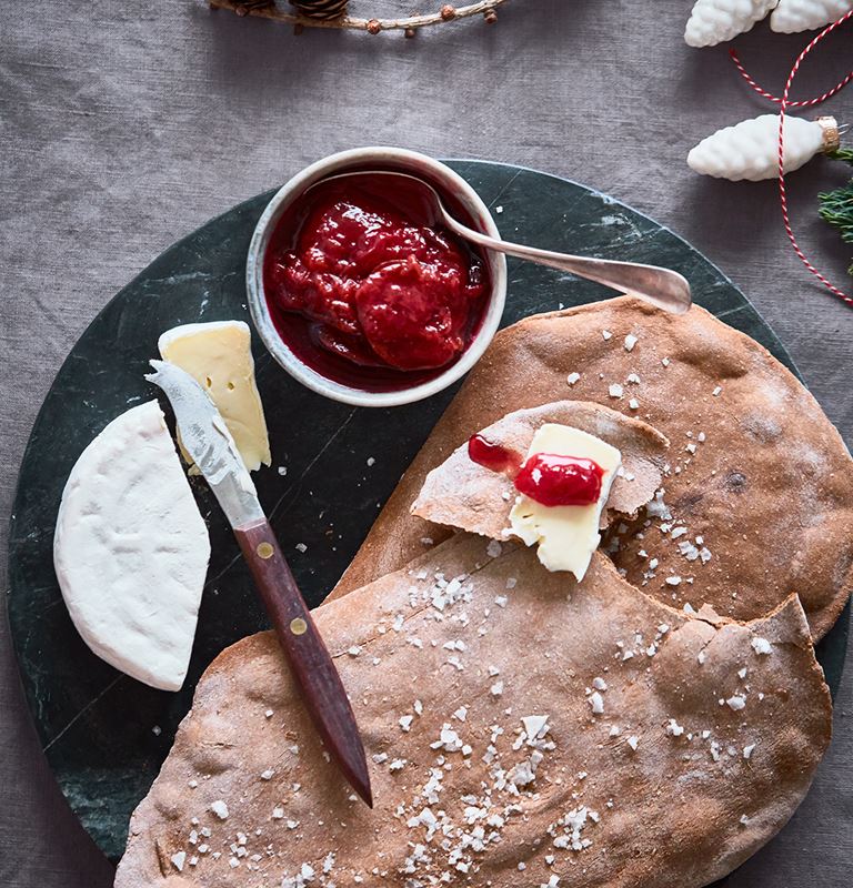 Giant crisp breads with plums and Double Crème White 