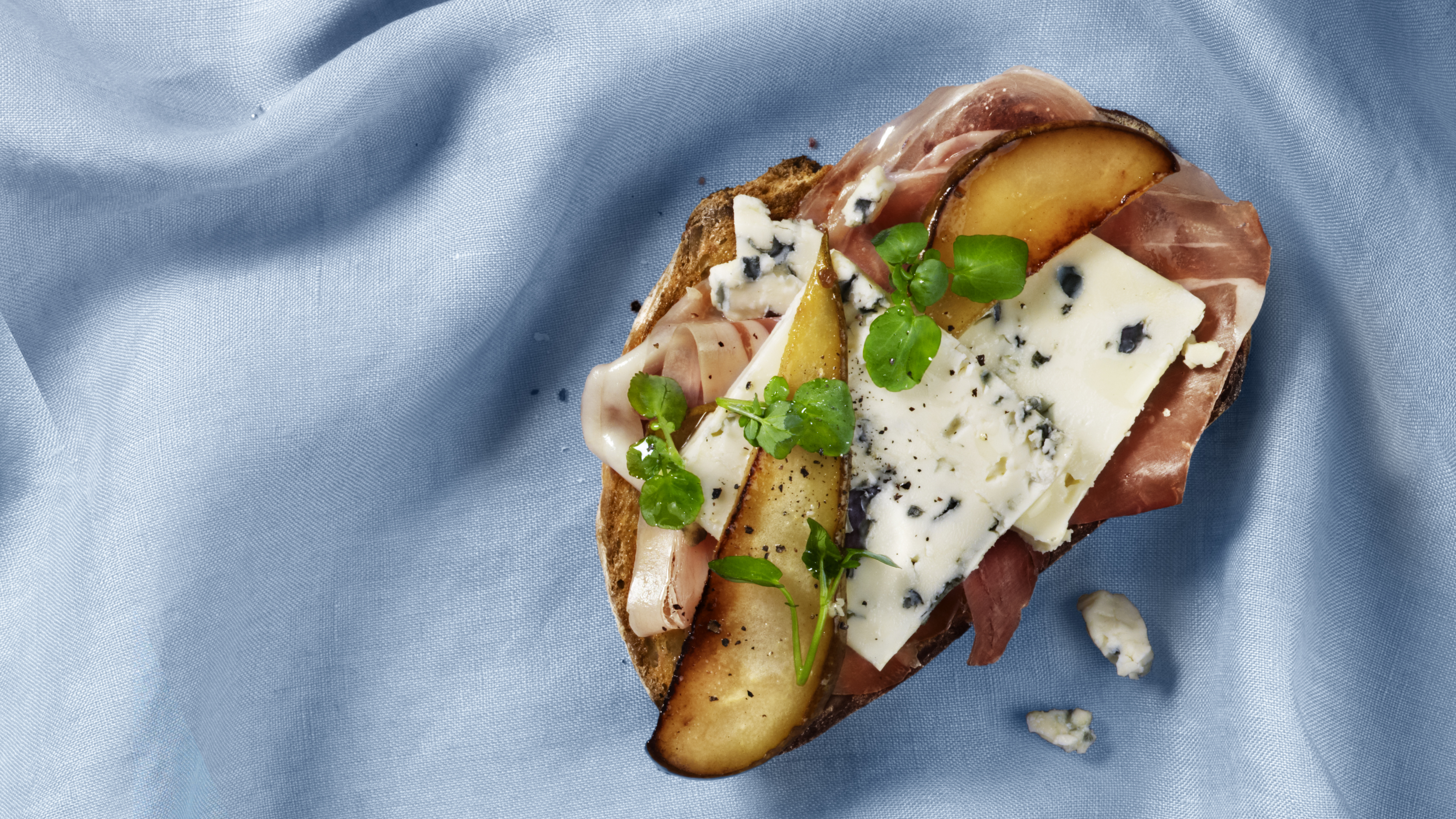 Prosciutto and pear open faced sandwich Castello