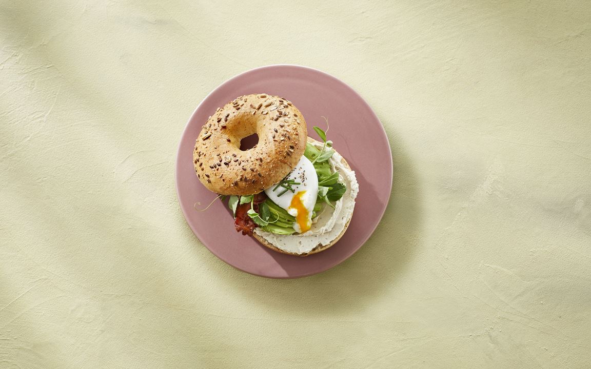 Bagel with Castello® pepper whipped cream cheese, bacon, egg, and avocado