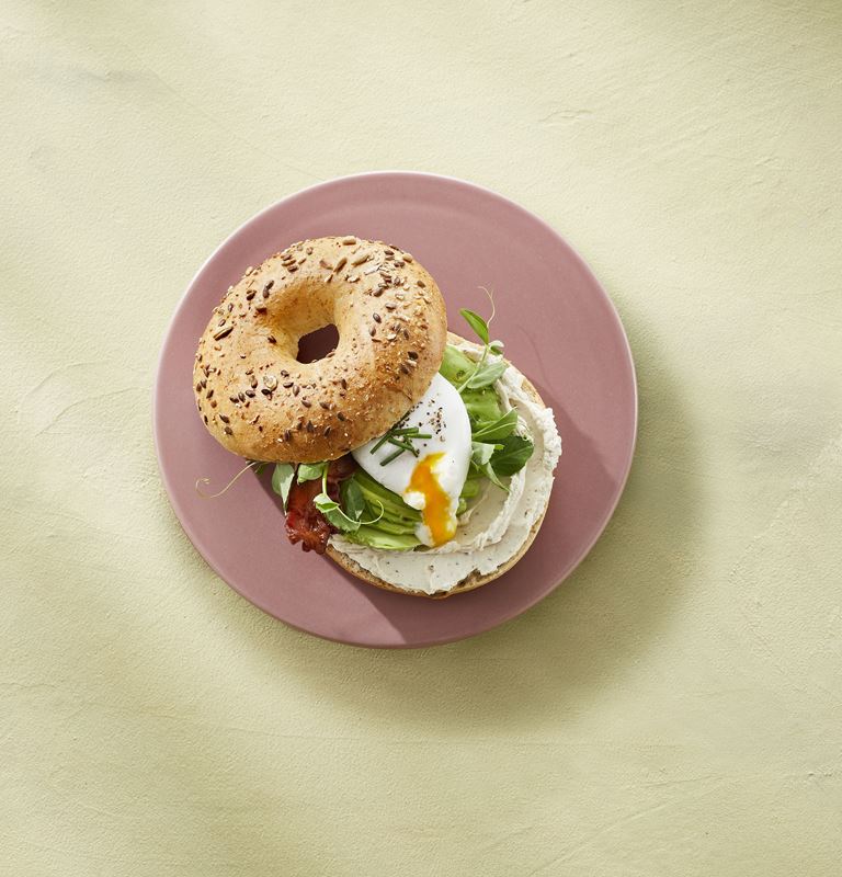 Bagel with Castello® pepper whipped cream cheese, bacon, egg, and avocado
