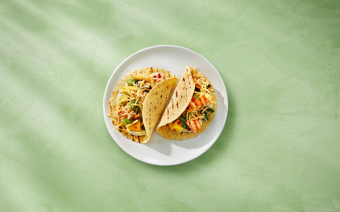 Fish tacos with salmon, mango salsa, and Castello® Tex-Mex Cheese