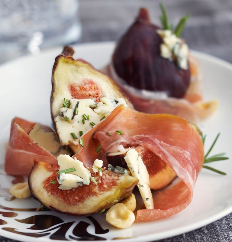 Grilled prosciutto wrapped figs stuffed with Blue Cheese