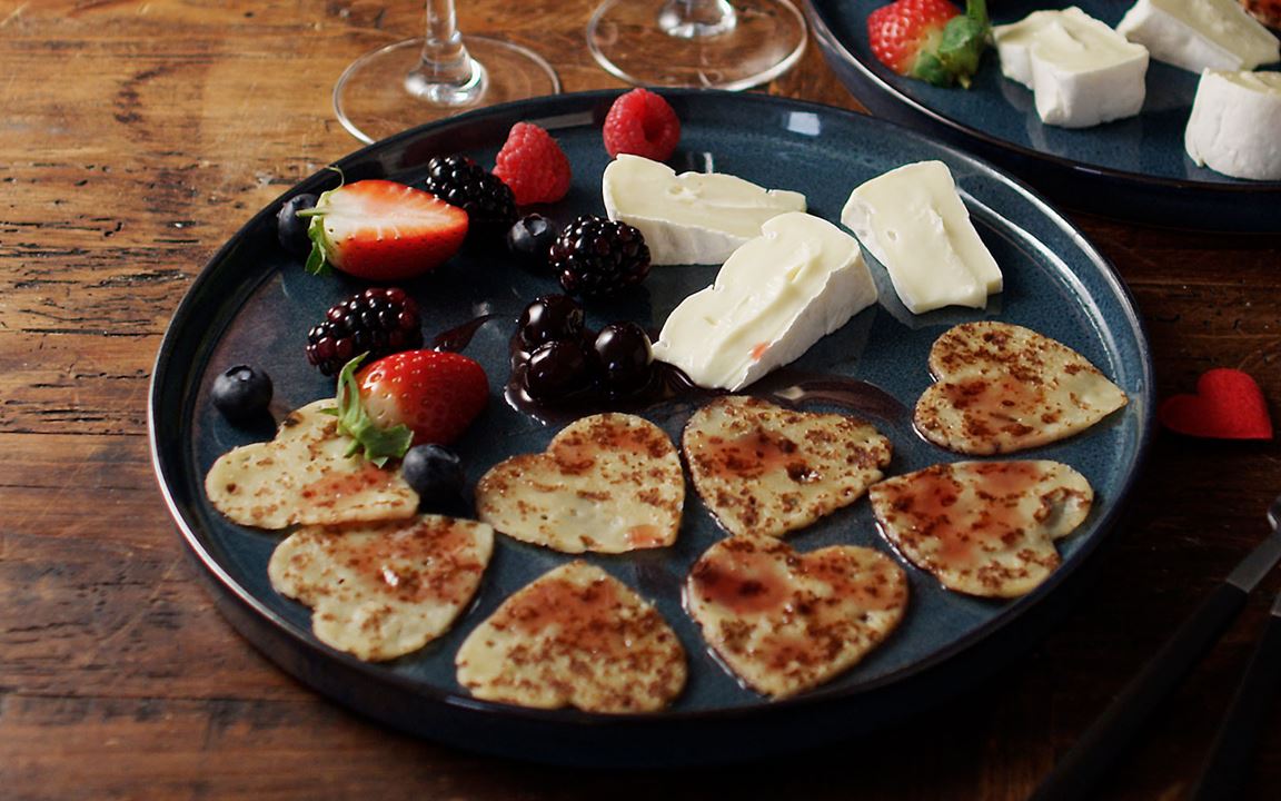 Heart-shaped pancakes with Creamy White and berries