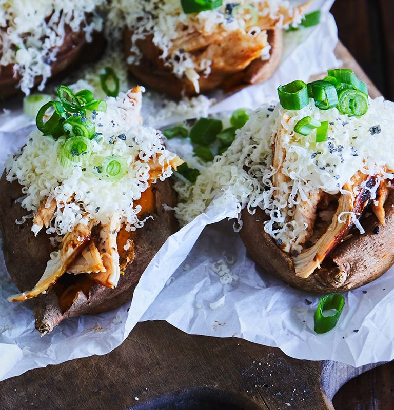 Baked sweet potatoes loaded with grilled chicken and Castello extra mature cheddar