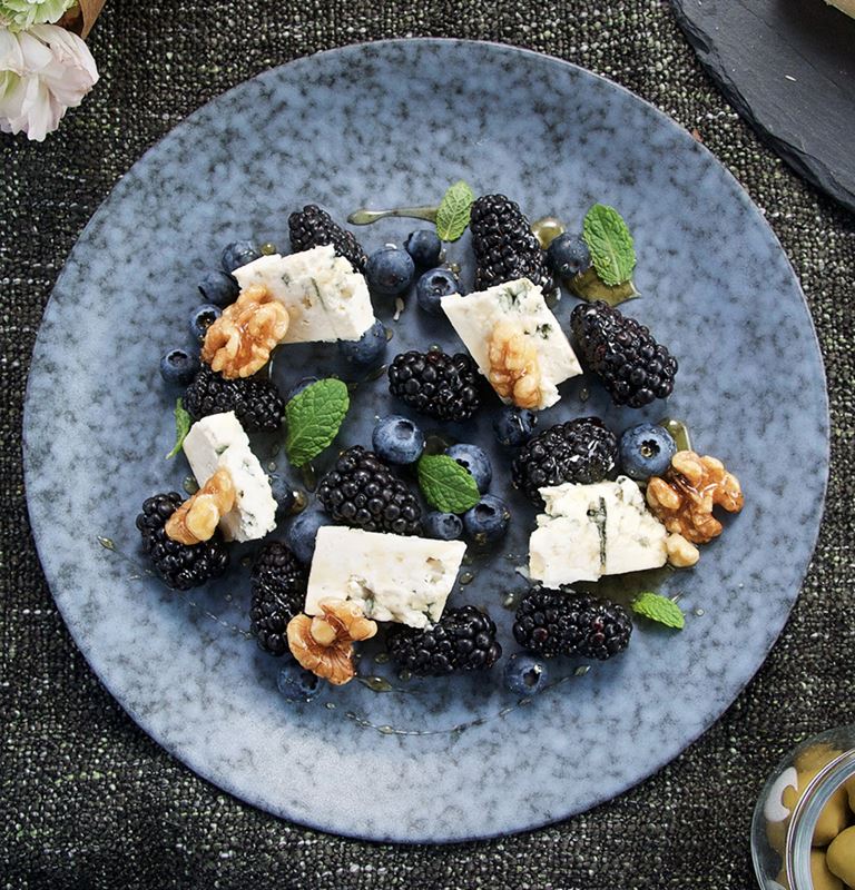 Blue cheese with berries and wet walnuts