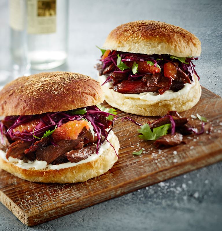 Duck burger with red cabbage salad and blue cheese dressing