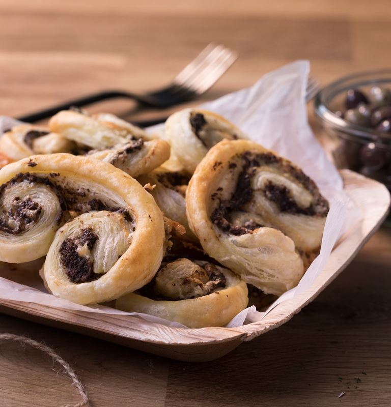 Savoury palmiers with olive tapenade and Extra Creamy Brie