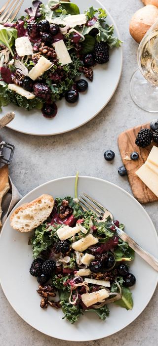 Blackberry and blueberry kale salad with Aged Havarti and berry dressing