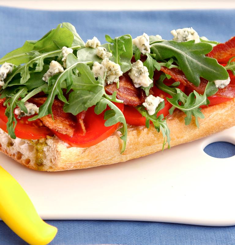 BLT salad on toasted baguette with blue cheese