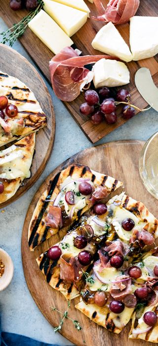 Grilled naan flatbread with grapes, onion jam, prosciutto and Double Creme Cheese