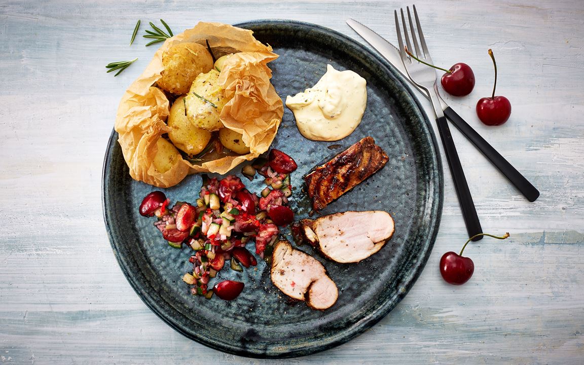 Grilled pork tenderloin with spicy cherry salsa and smoked potatoes 