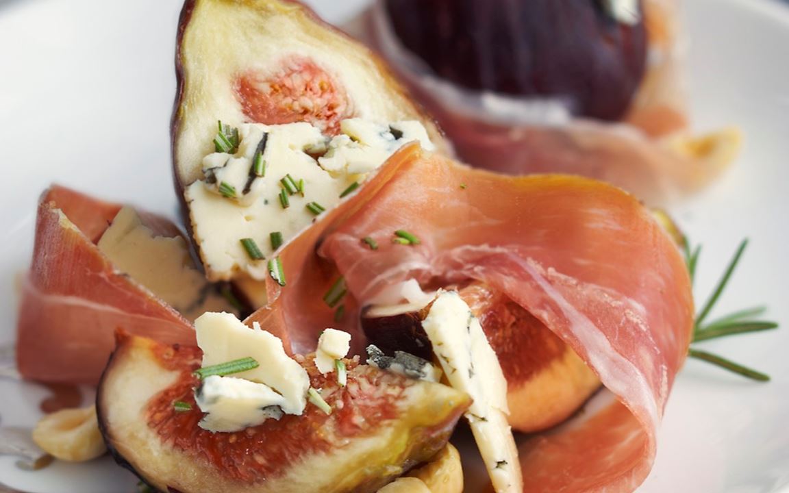 Grilled prosciutto-wrapped figs stuffed with Blue Cheese