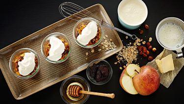 Apple-prune trifle with roasted rye flakes and whipped cream