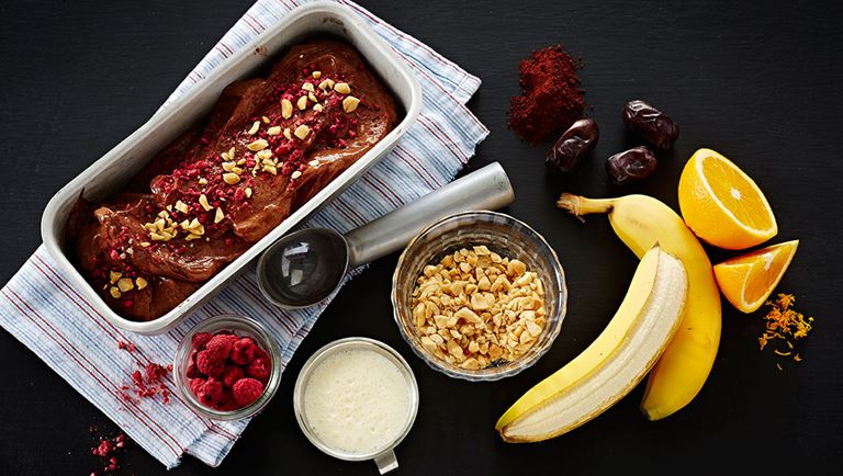 Banana ice cream with cocoa and peanuts