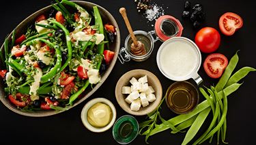 Bean salad with olives, shallots, tomato, tarragon and cheese cream