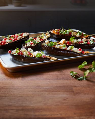 Baked aubergine with feta and pomegranate